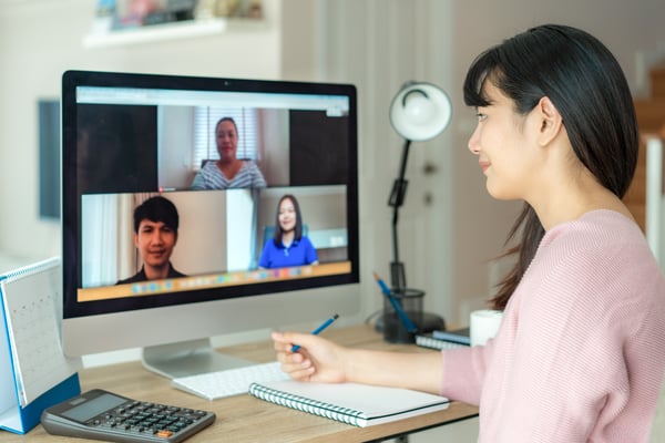 employees collaborating via video conferencing